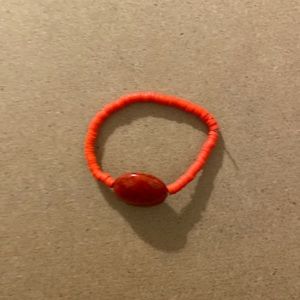 Red bracelet with marble bead